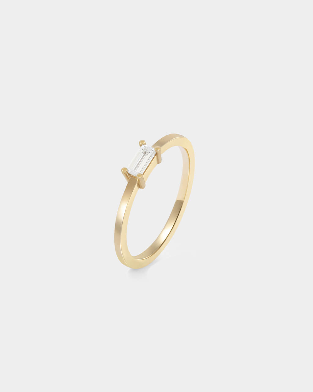 Verlobungsring mit Baguette Diamant in Gelbgold